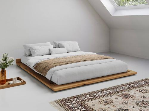 wooden low attic bed in honey