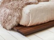 wooden low attic bed close up coffee bean