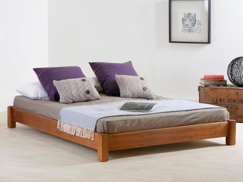 low wooden platform bed without headboard