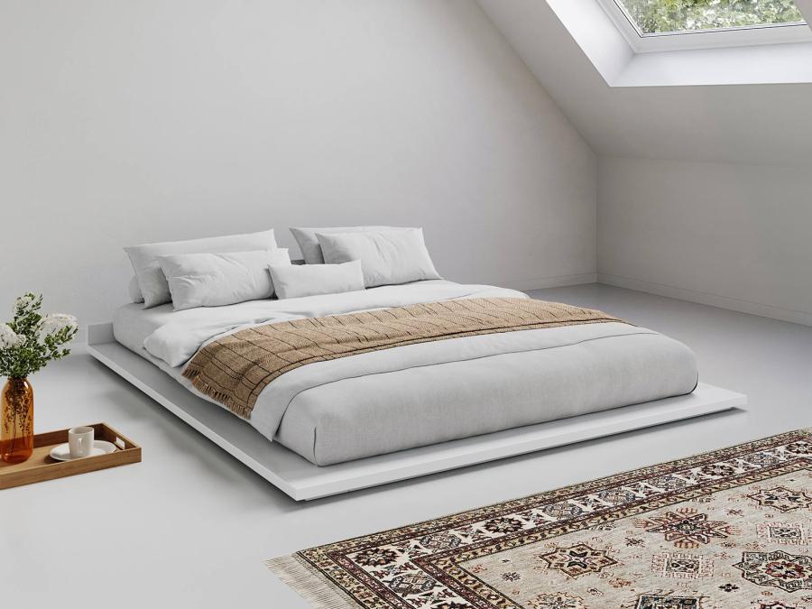 low wooden white attic bed